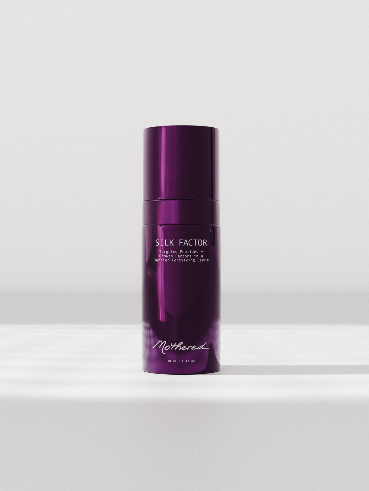 Mothered Silk Factor Serum front view purple glass bottle with cap